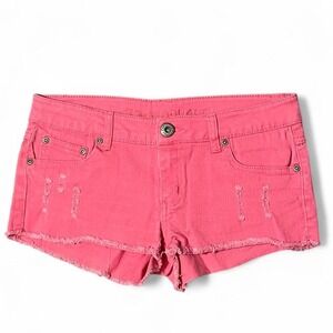 Pink low rise shorts with frayed hem and distressing